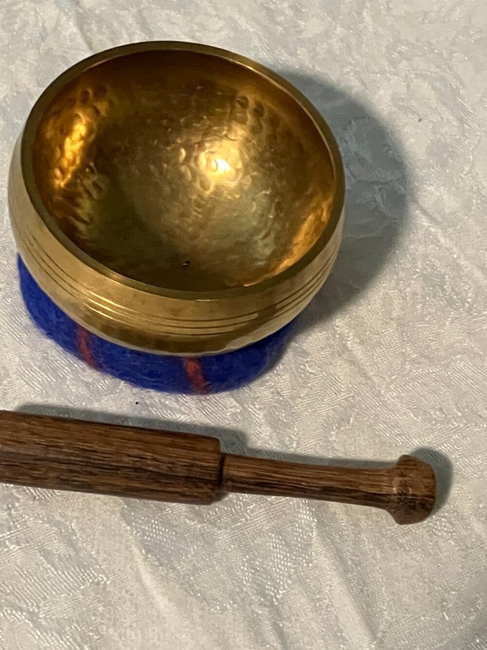 Tibetan singing bowl with striker and cushion